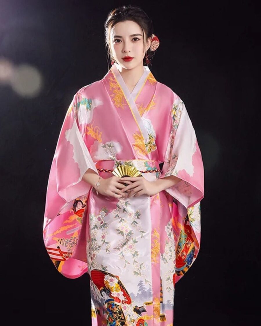 Kimono rose traditionnel japonais pour femme sur fond noir